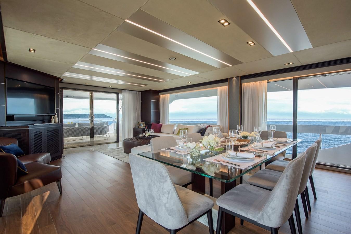 a large dining room with a large window aboard HORIZON Yacht for Sale
