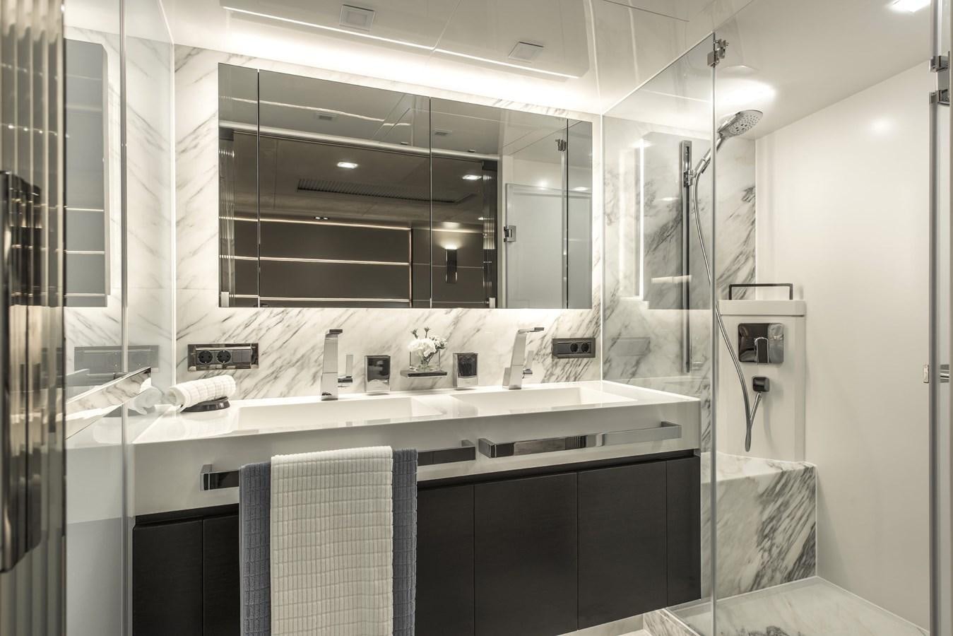 a bathroom with a large mirror aboard HORIZON Yacht for Sale