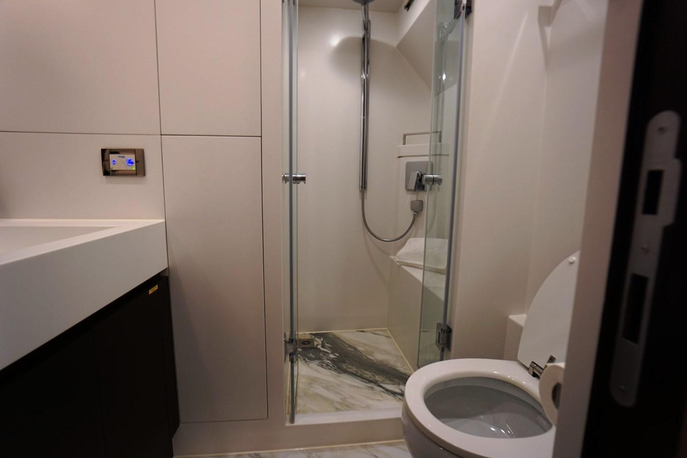 a bathroom with a shower unit aboard HORIZON Yacht for Sale
