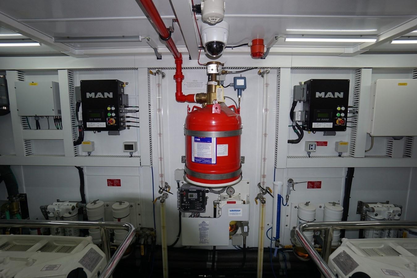 a large white machine with red and silver containers aboard HORIZON Yacht for Sale