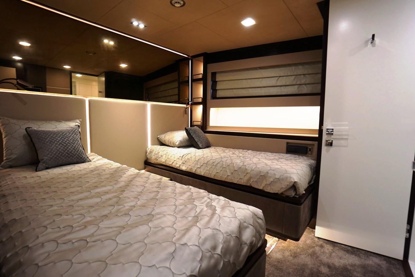 a room with two beds aboard HORIZON Yacht for Sale