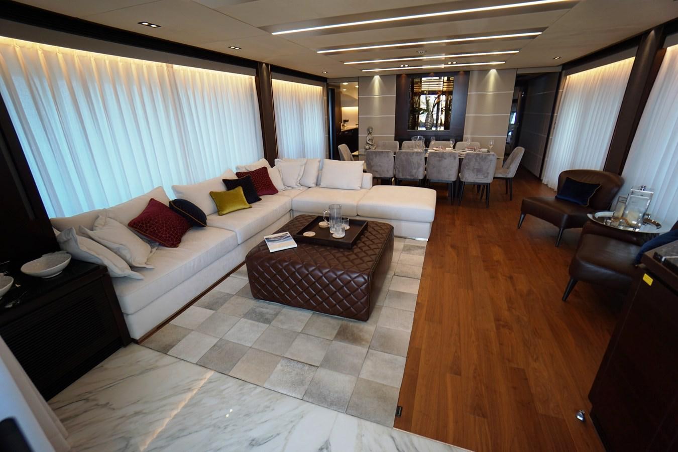 a living room with a large bed aboard HORIZON Yacht for Sale