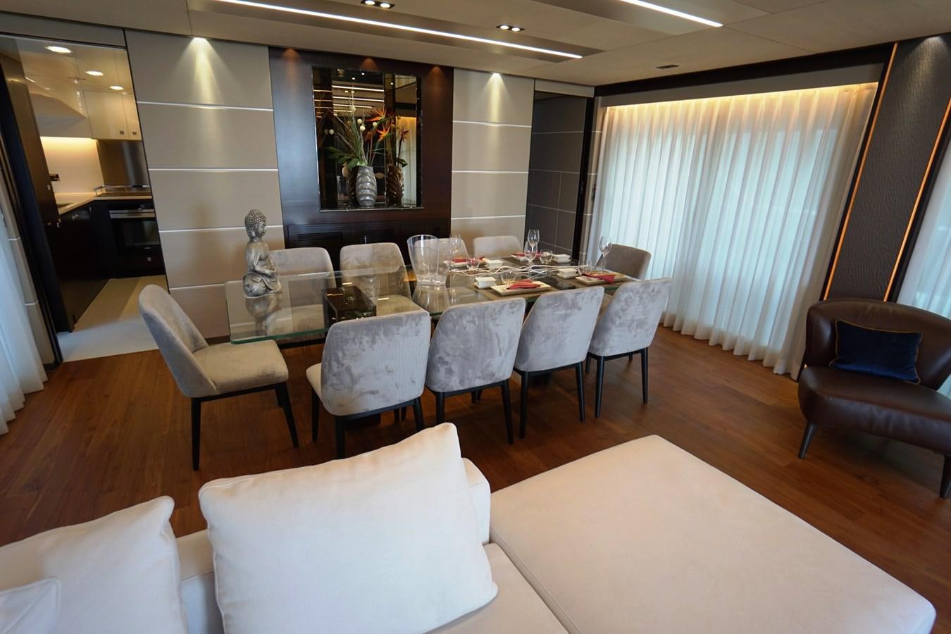 a dining room with a table and chairs aboard HORIZON Yacht for Sale