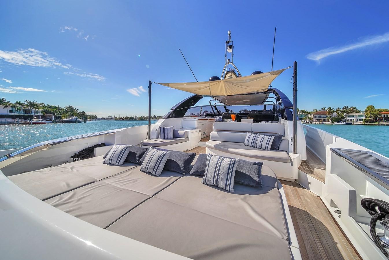 a boat on a dock aboard RIVA 76' BAHAMAS Yacht for Sale