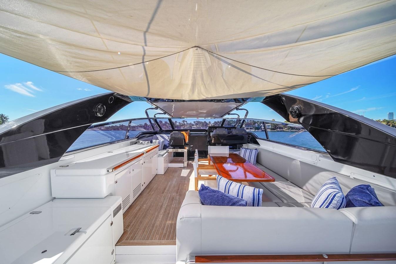 a boat with a canopy aboard RIVA 76' BAHAMAS Yacht for Sale