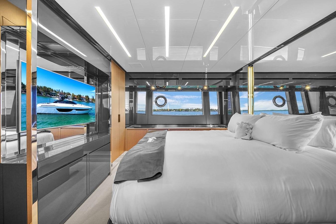 a bed in a room aboard RIVA 76' BAHAMAS Yacht for Sale