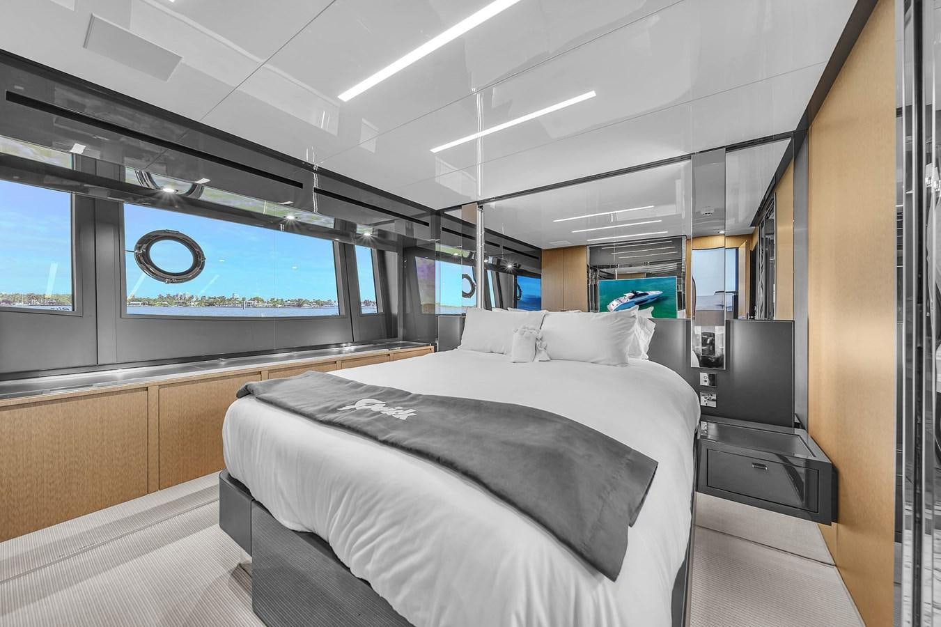 a room with a bed and a tv aboard RIVA 76' BAHAMAS Yacht for Sale