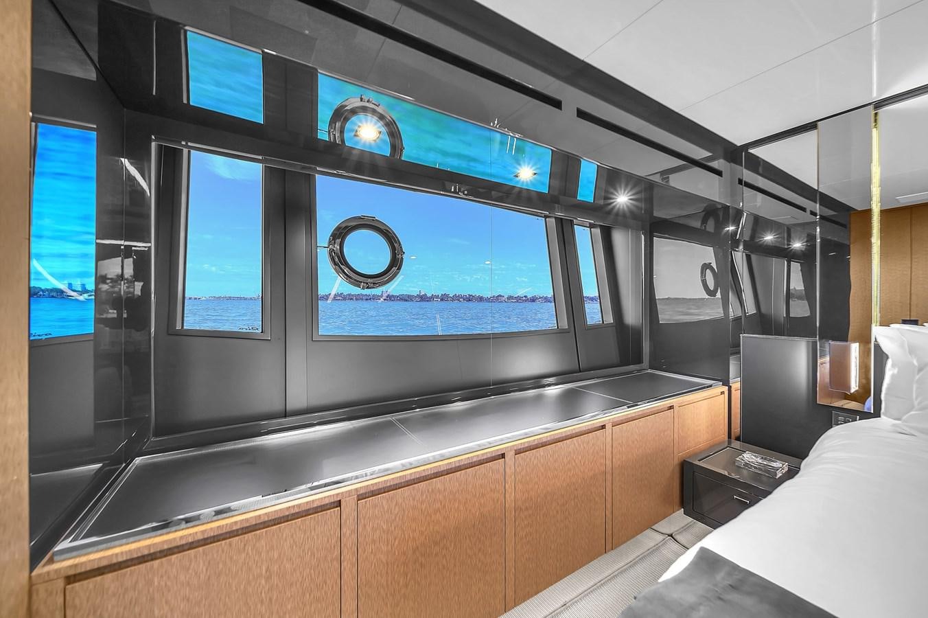 a room with a large screen aboard RIVA 76' BAHAMAS Yacht for Sale