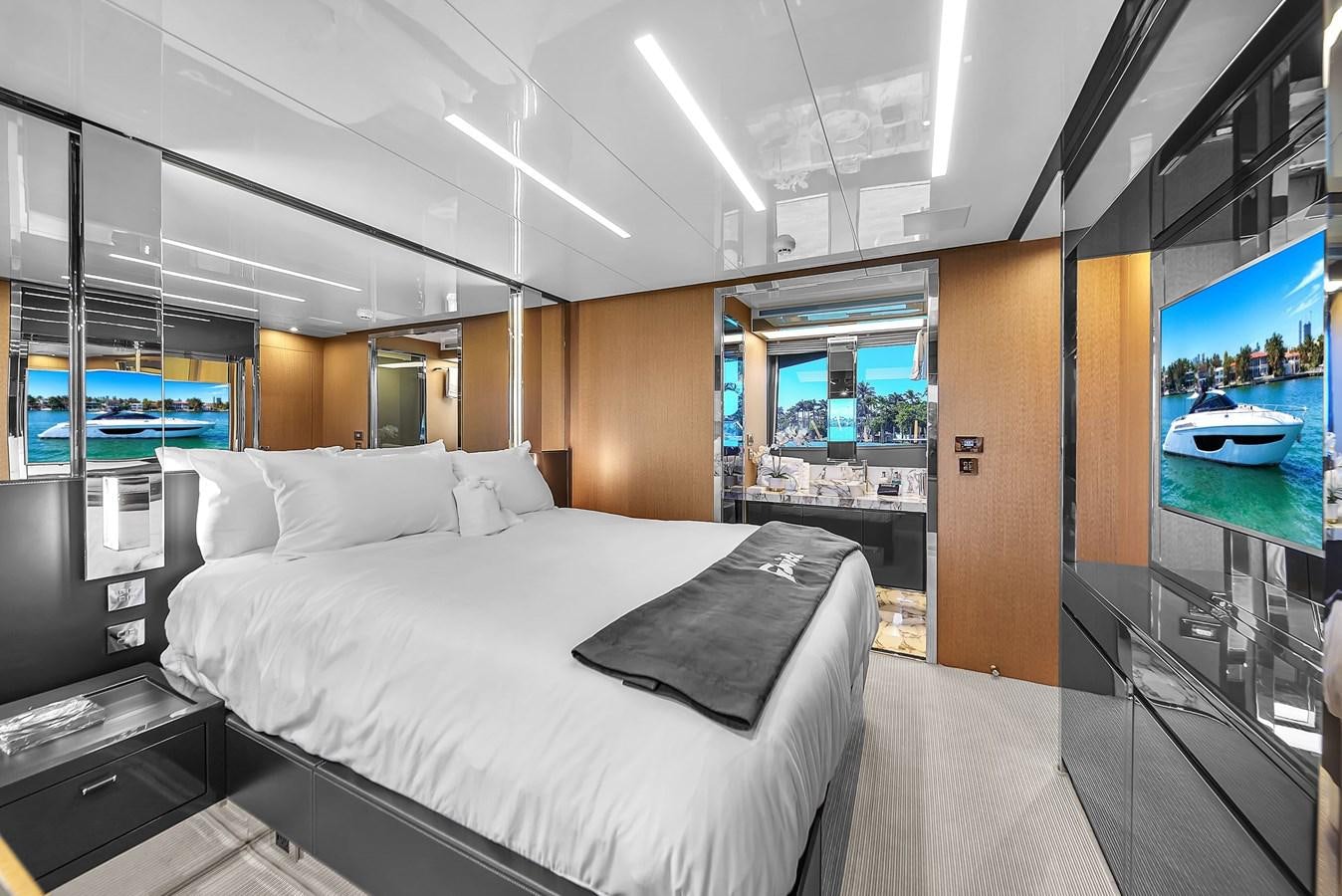 a bed in a room aboard RIVA 76' BAHAMAS Yacht for Sale
