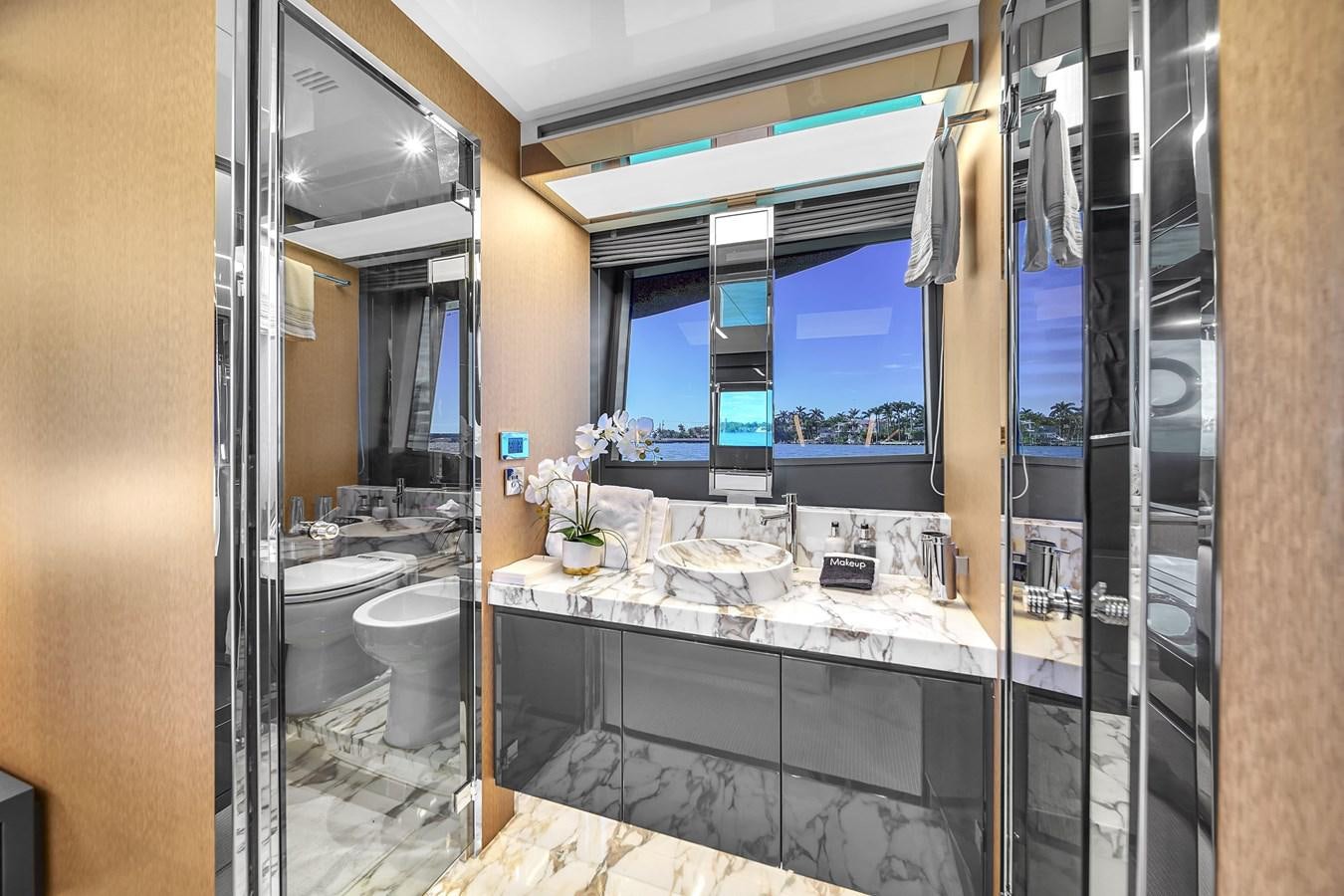 a bathroom with a large countertop aboard RIVA 76' BAHAMAS Yacht for Sale