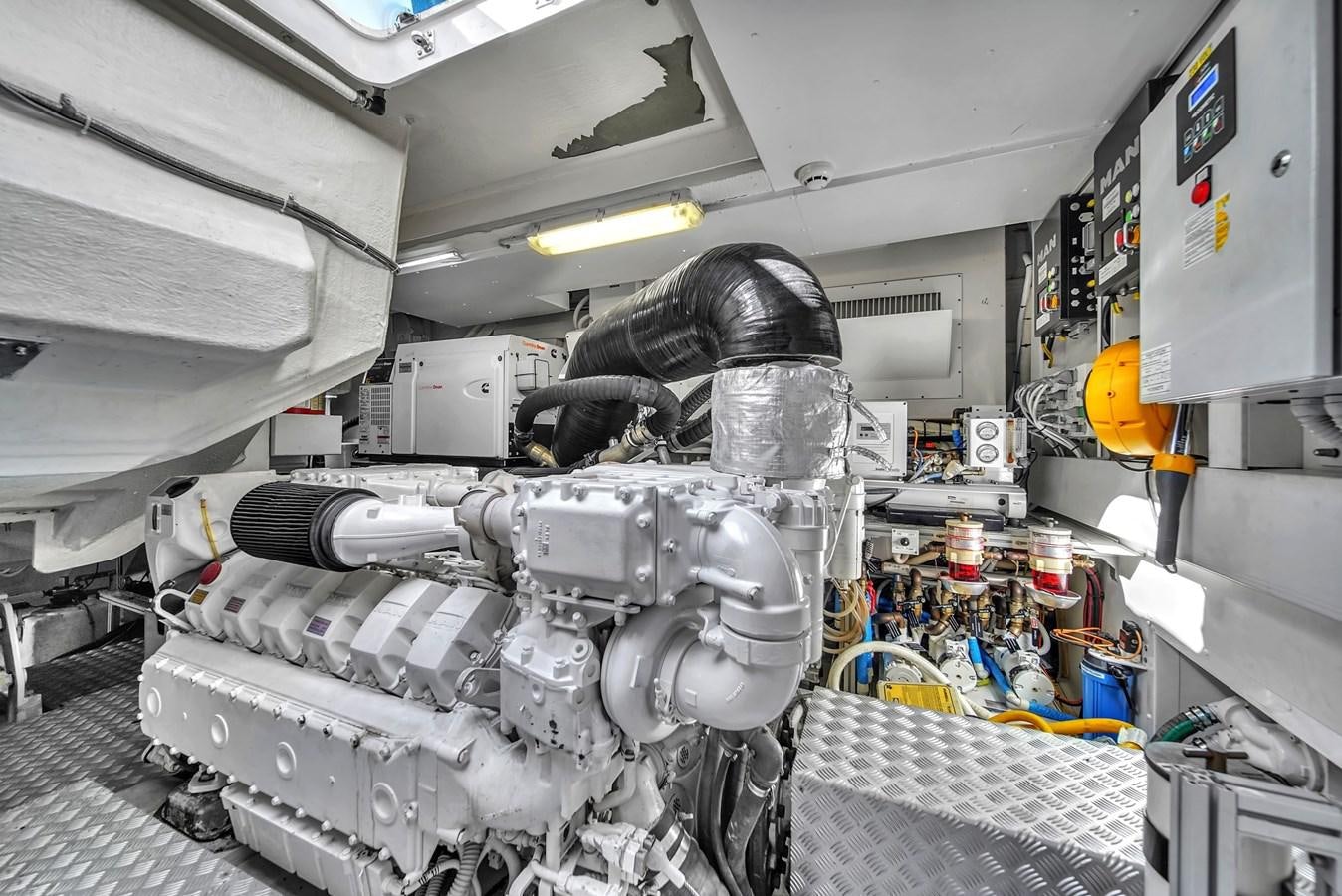 a machine in a room aboard RIVA 76' BAHAMAS Yacht for Sale