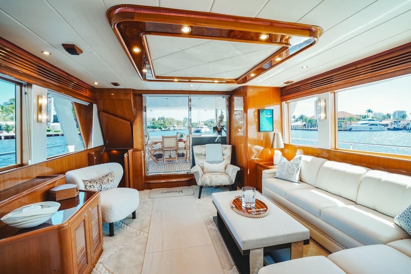 a living room with a large window aboard VIAGGIO Yacht for Sale