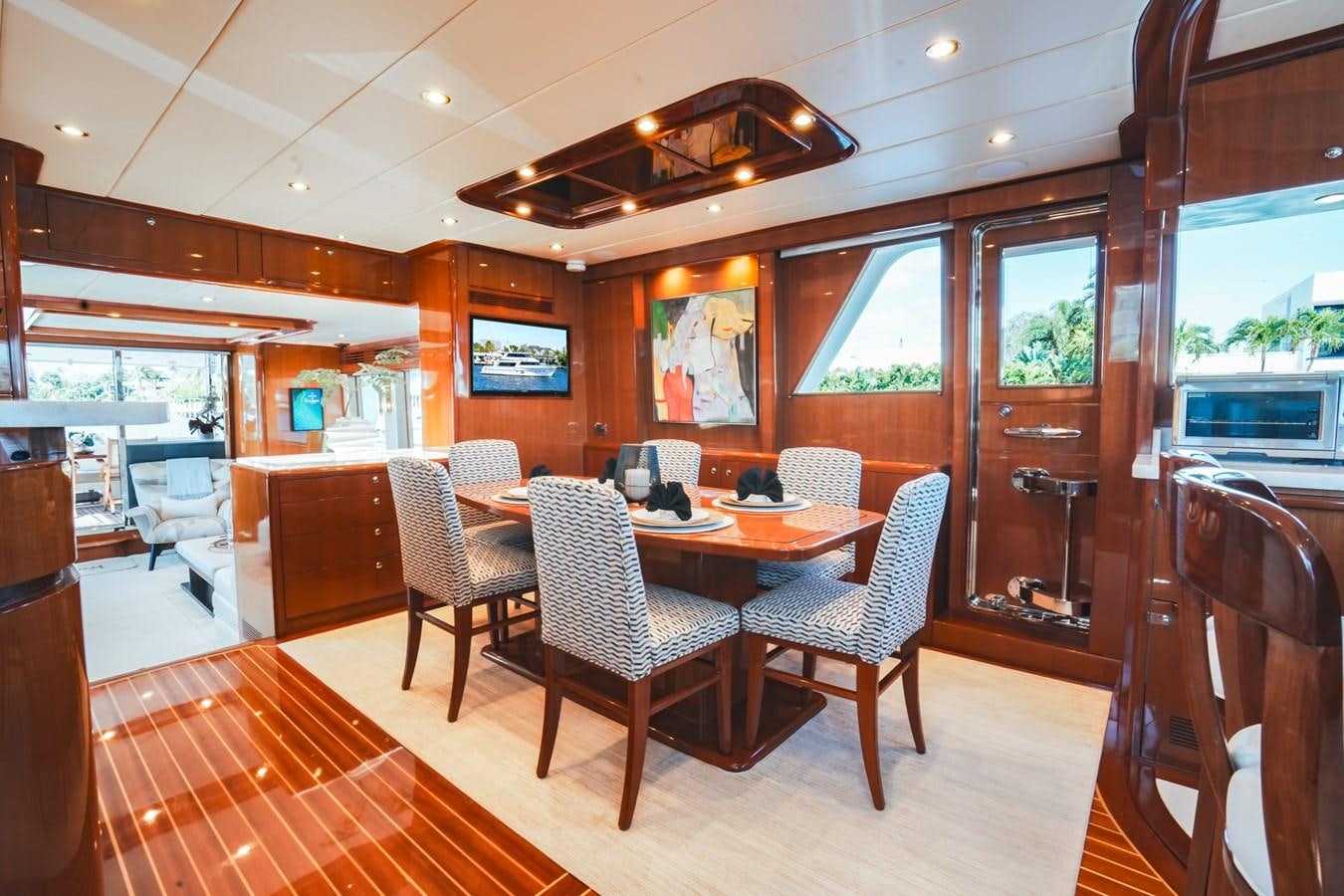 a dining room with a table and chairs aboard VIAGGIO Yacht for Sale
