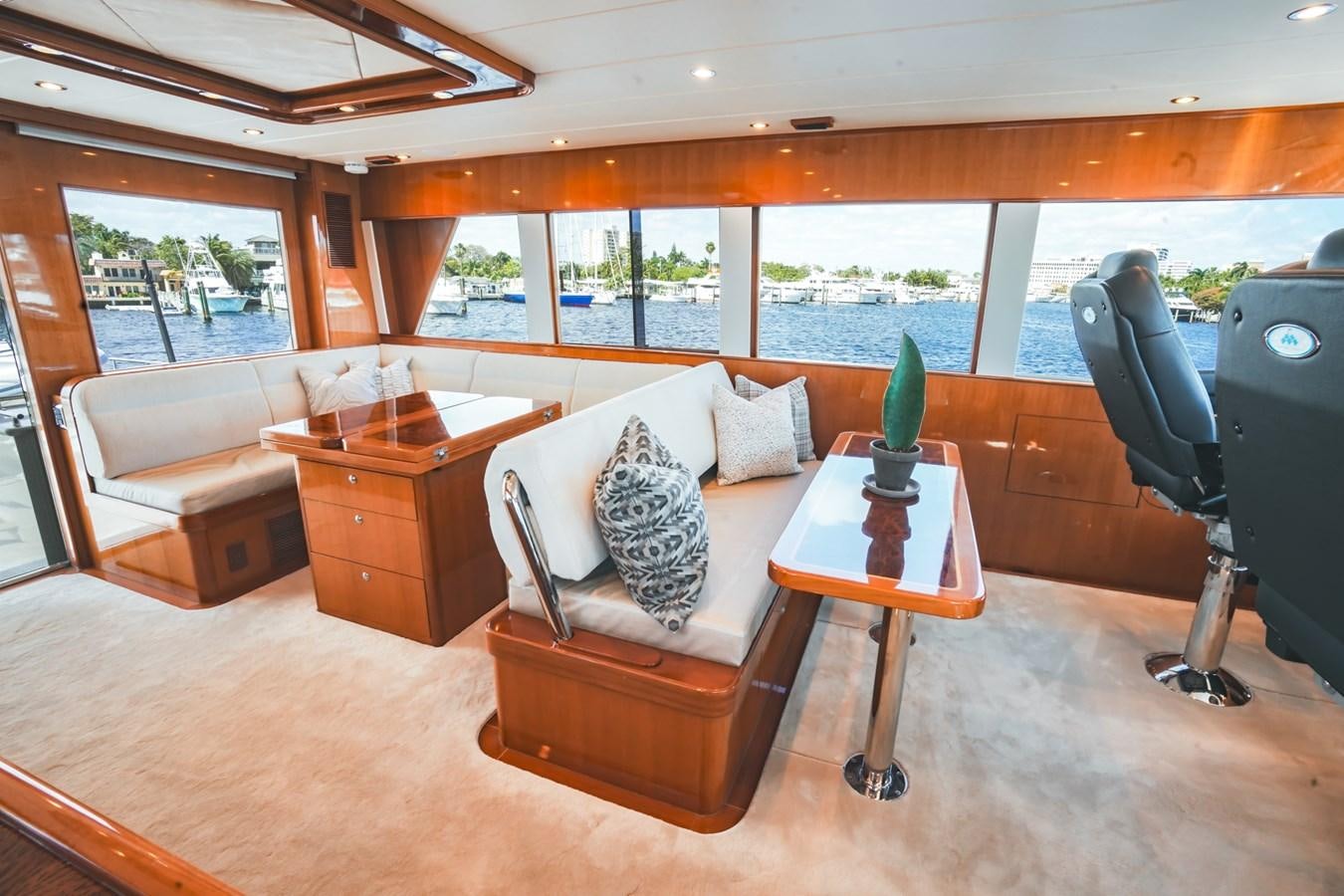 a living room with a couch and a coffee table aboard VIAGGIO Yacht for Sale