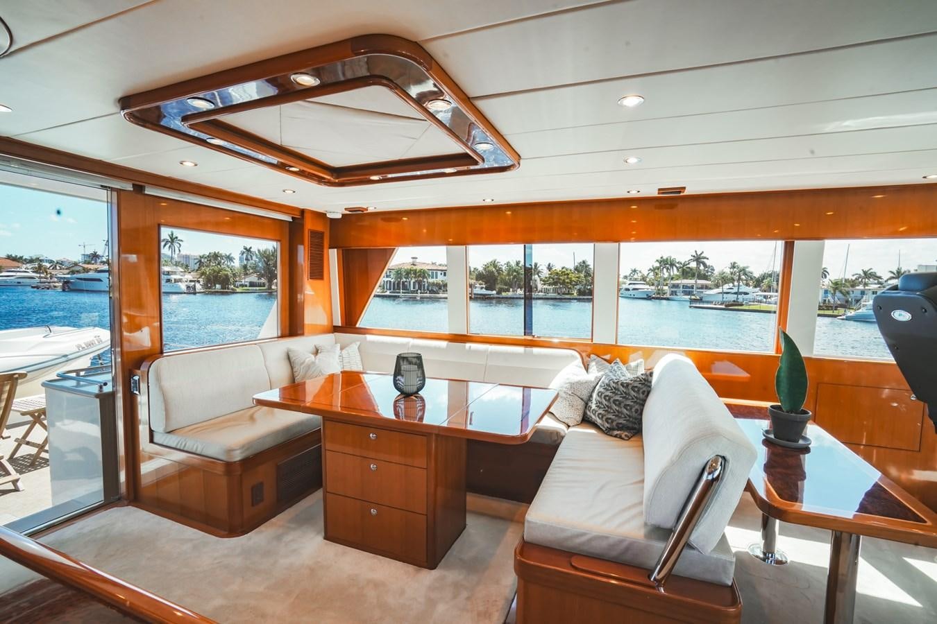a living room with a view of the ocean aboard VIAGGIO Yacht for Sale