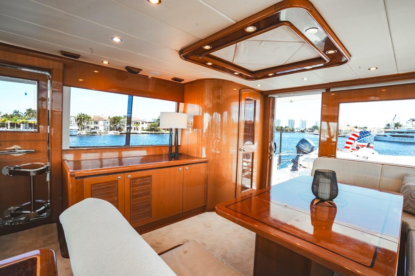 a room with a table and chairs aboard VIAGGIO Yacht for Sale
