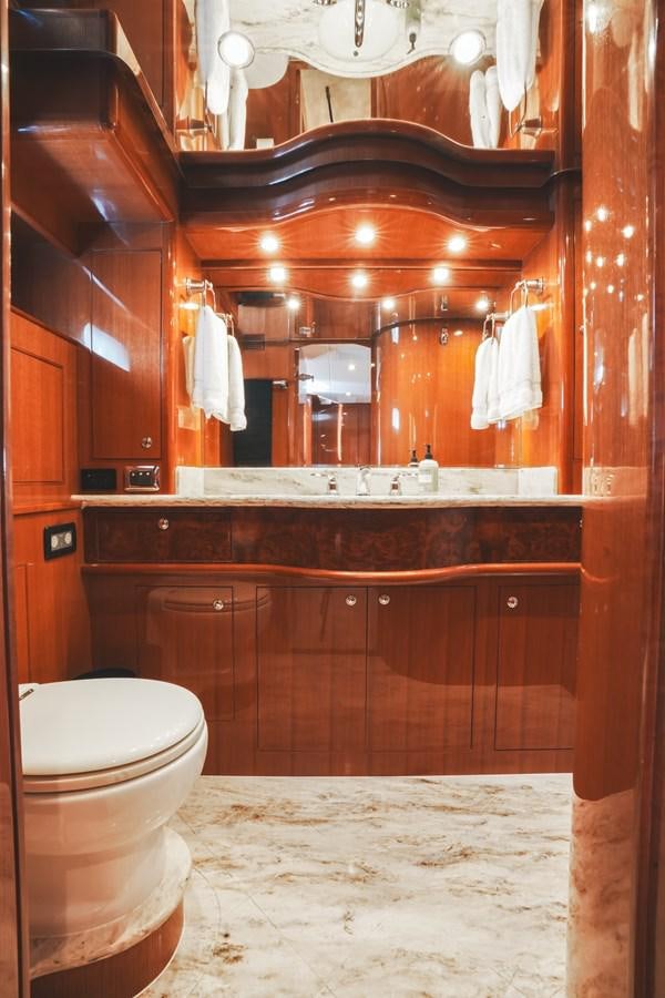 a bathroom with a large mirror aboard VIAGGIO Yacht for Sale