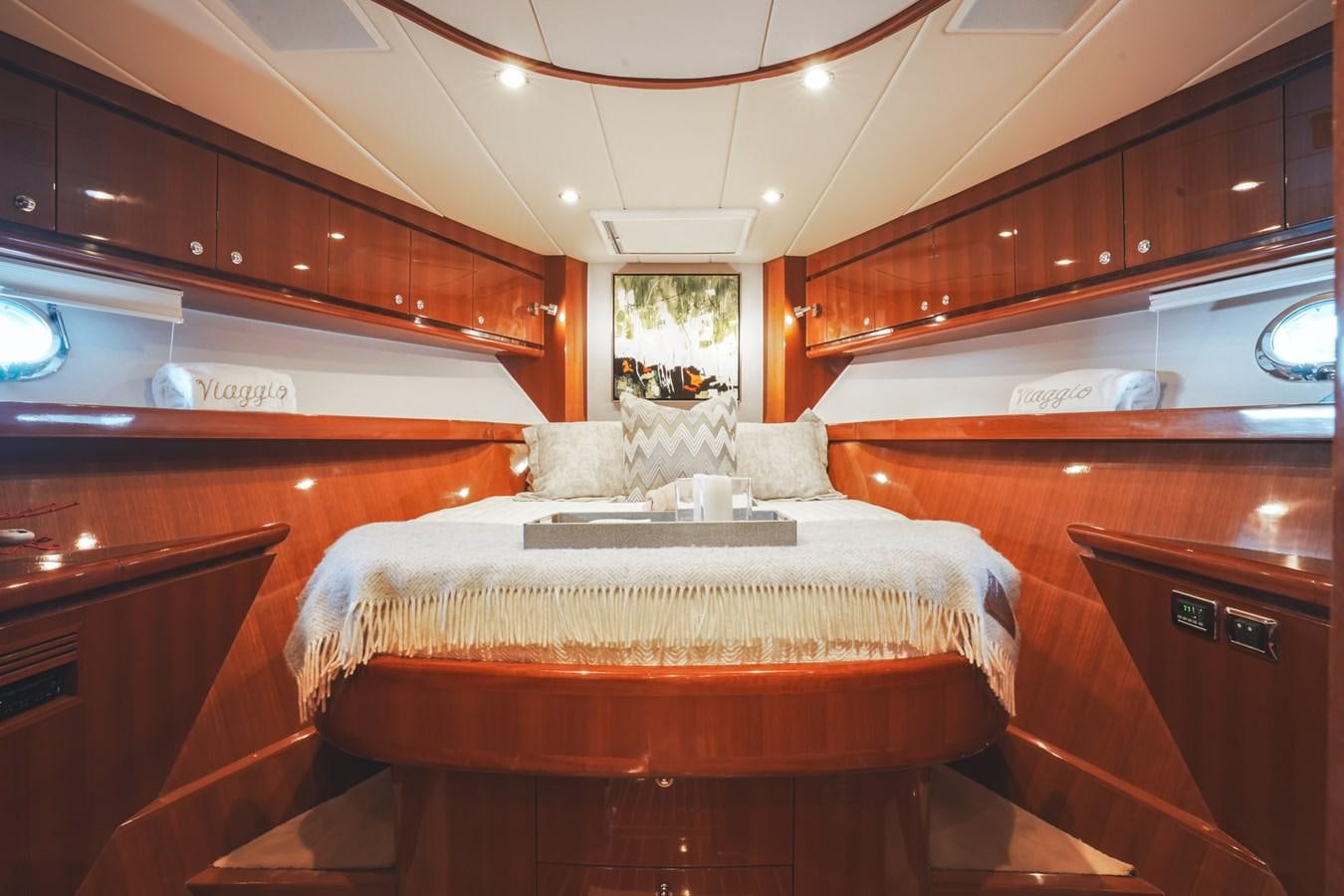 a bedroom with a bed aboard VIAGGIO Yacht for Sale