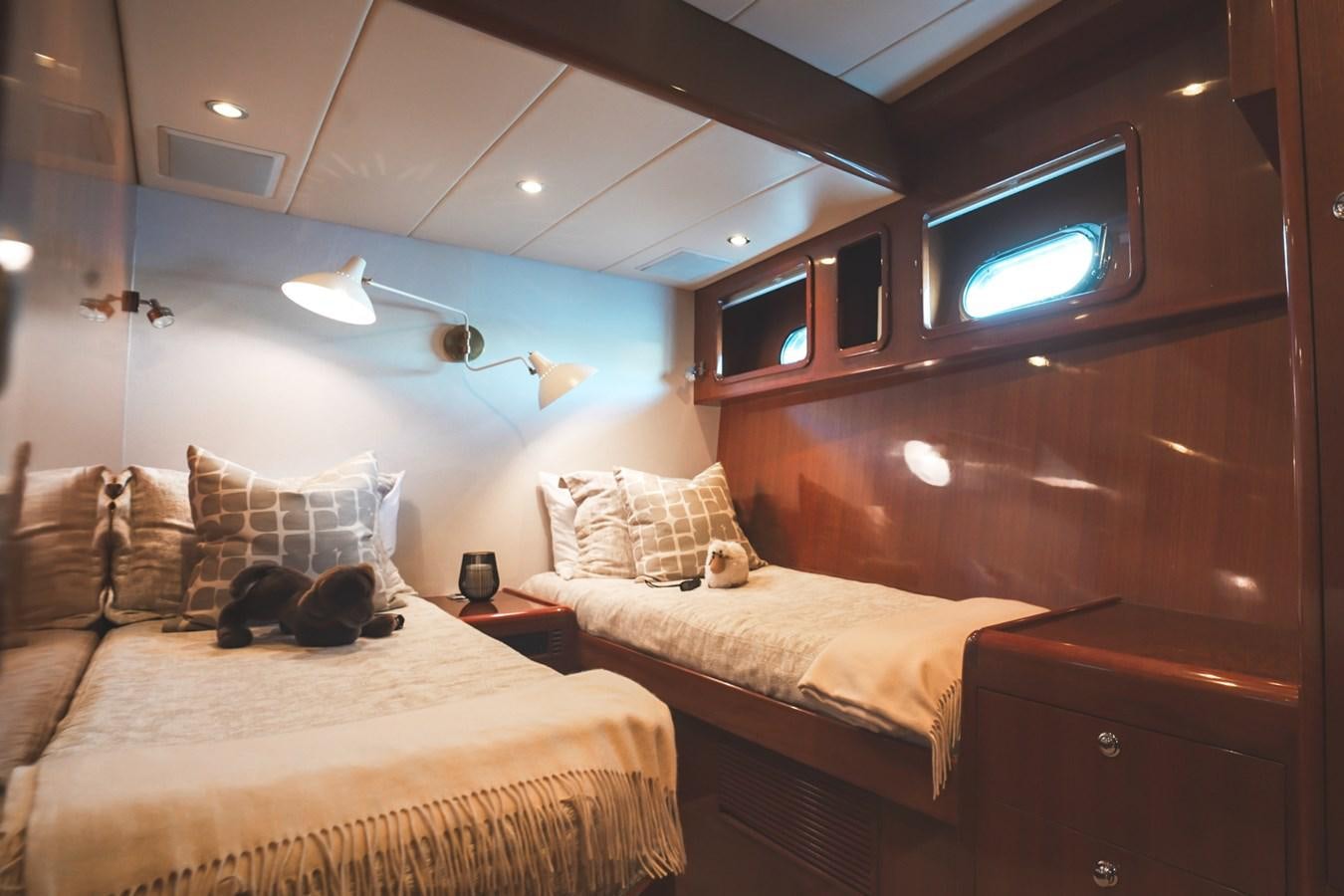 a room with two beds aboard VIAGGIO Yacht for Sale