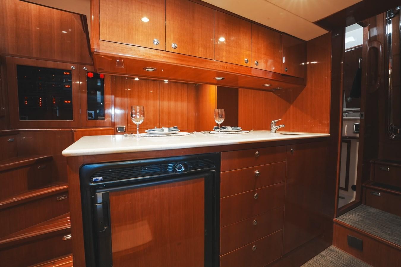 a kitchen with wooden cabinets aboard VIAGGIO Yacht for Sale