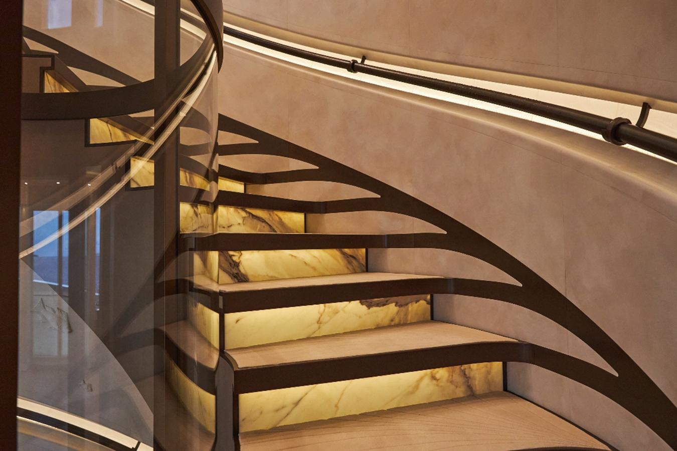 a bed with a striped sheet aboard LUNA Yacht for Sale