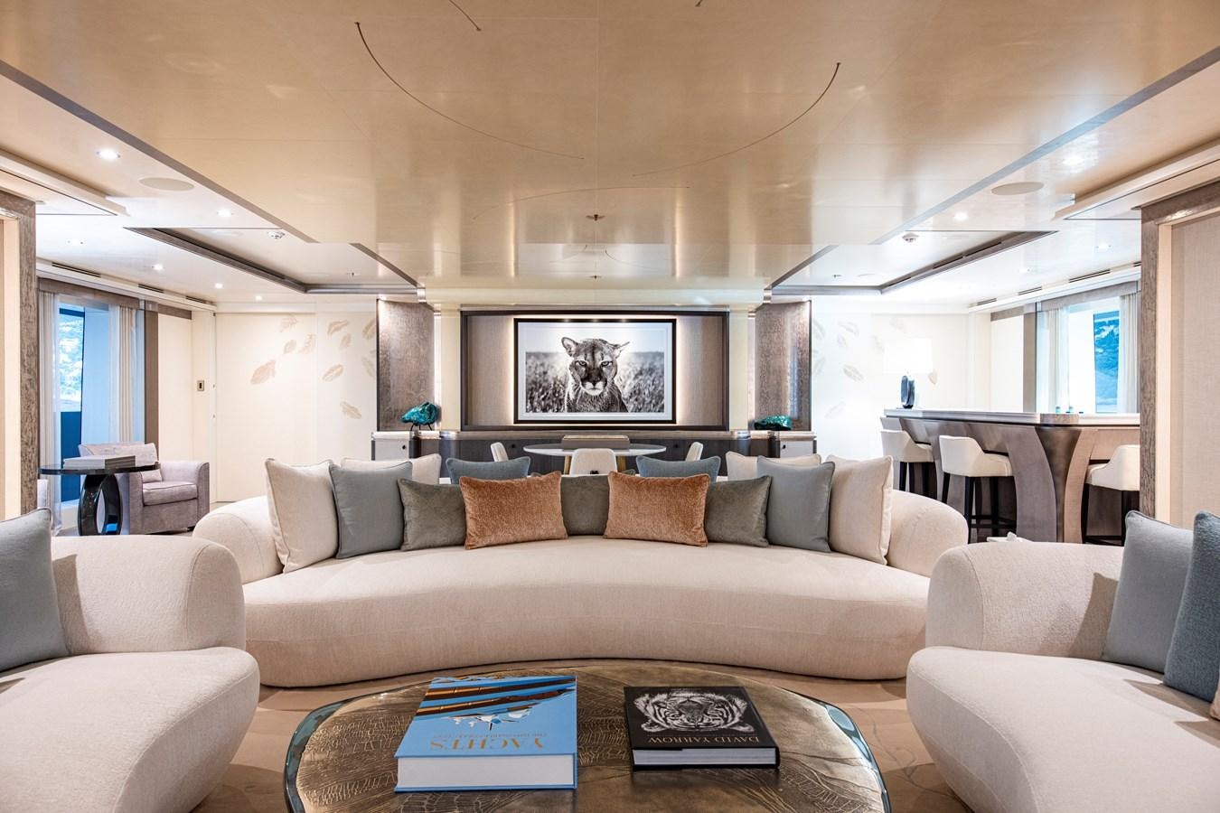 a living room with a large screen aboard LUNA Yacht for Sale