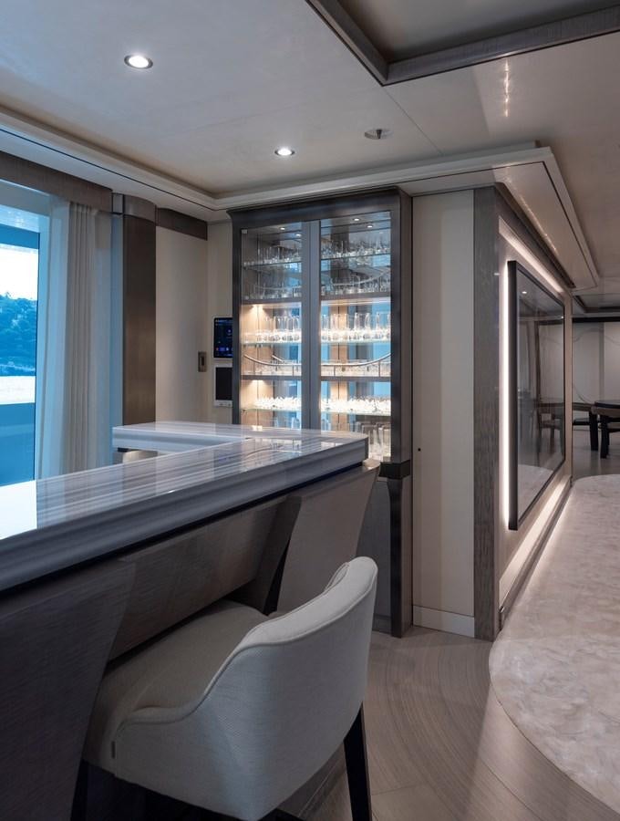 a room with a table and chairs aboard LUNA Yacht for Sale