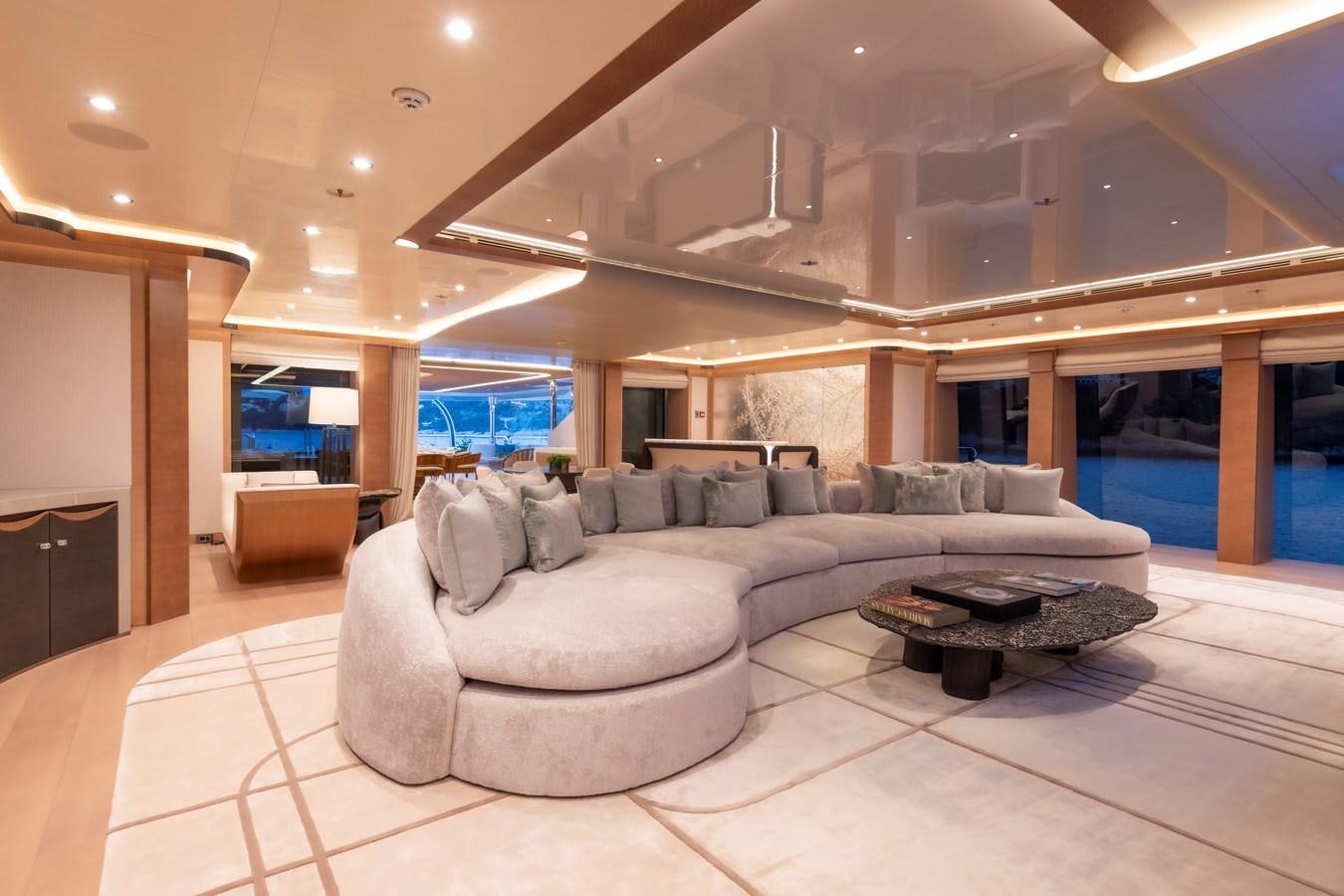 a large living room with a large glass window aboard LUNA Yacht for Sale