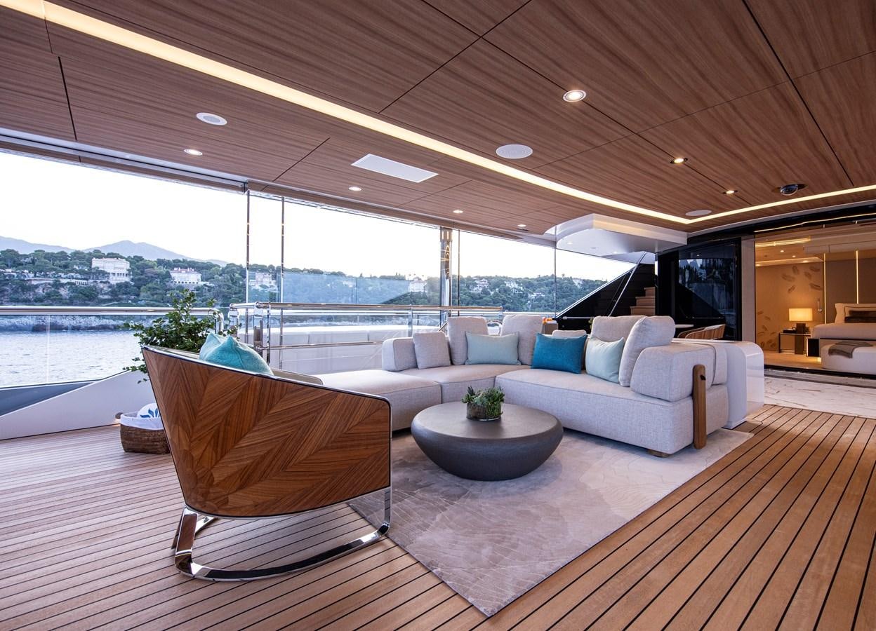 a living room with a large window aboard LUNA Yacht for Sale