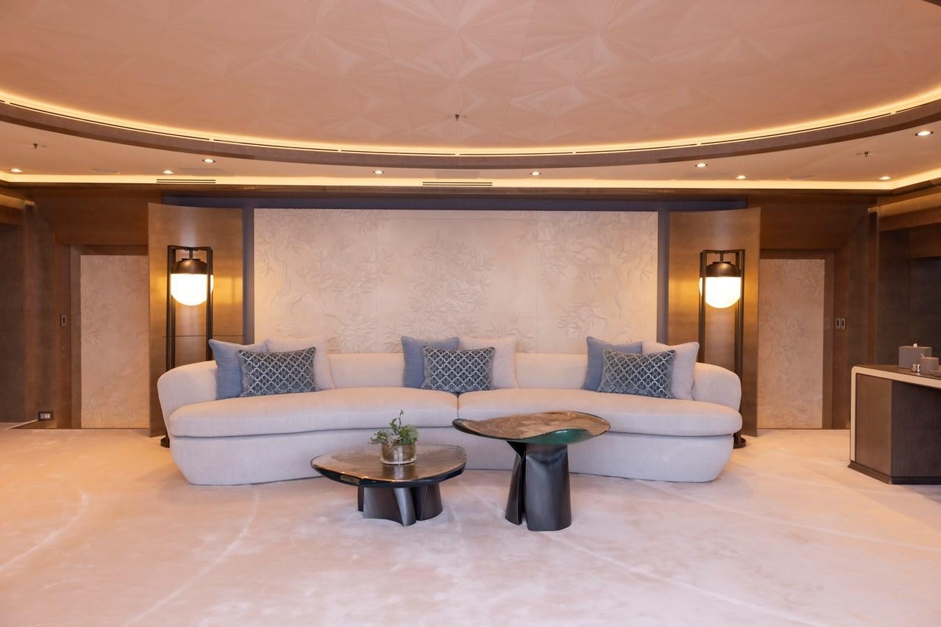 a living room with a couch and a coffee table aboard LUNA Yacht for Sale