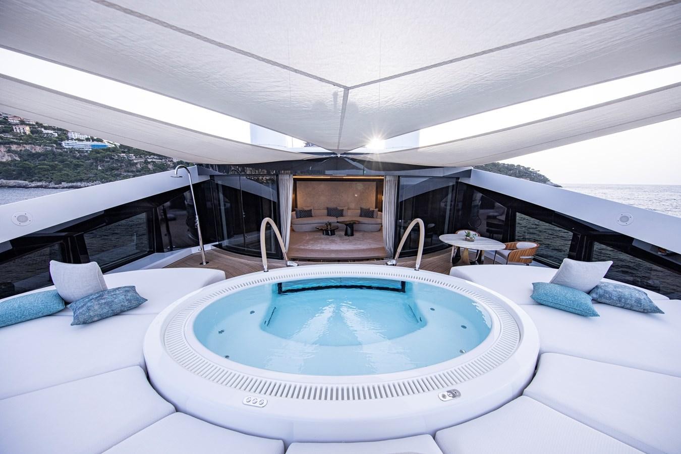a large swimming pool in a room aboard LUNA Yacht for Sale