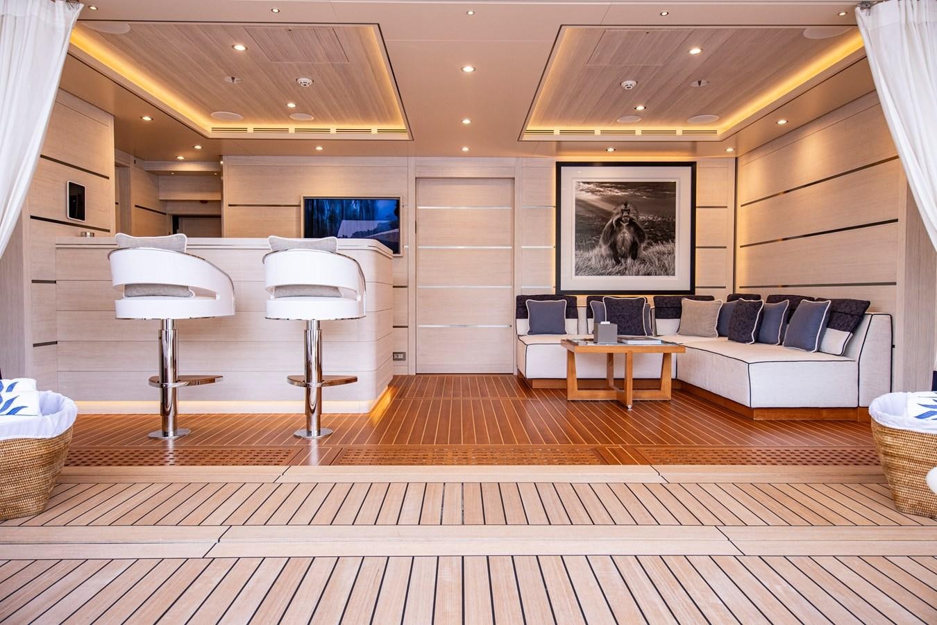 a room with a couch and a table aboard LUNA Yacht for Sale