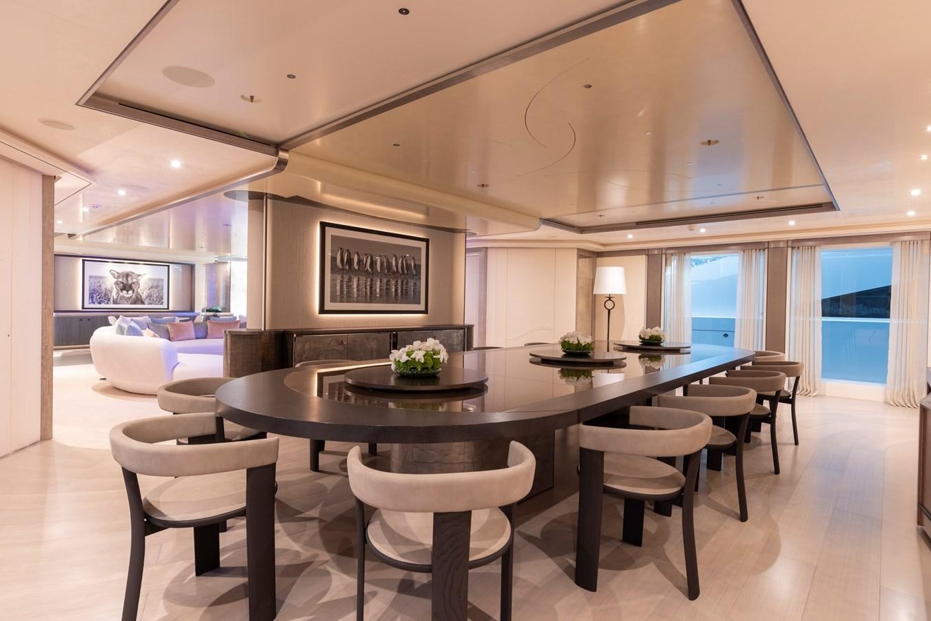 a large kitchen with a table aboard LUNA Yacht for Sale