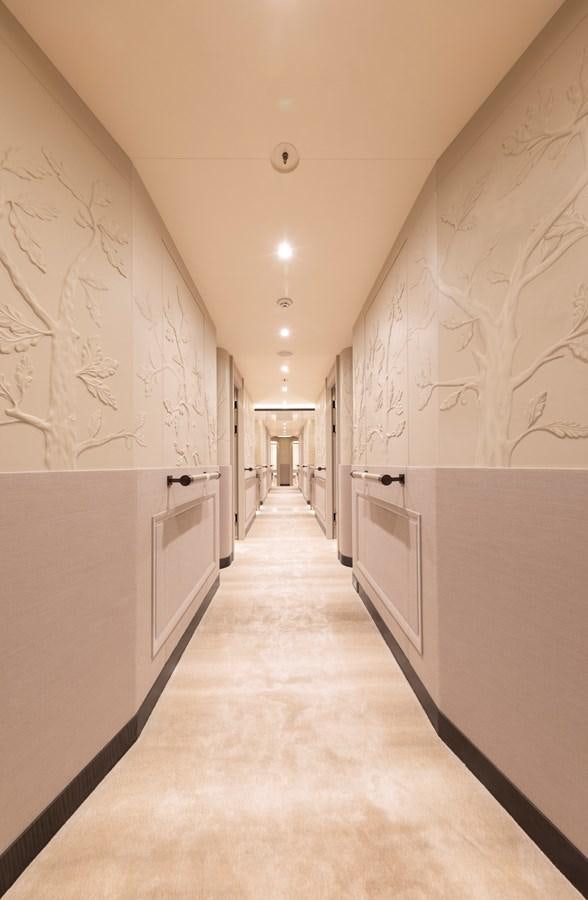 a hallway with white walls aboard LUNA Yacht for Sale