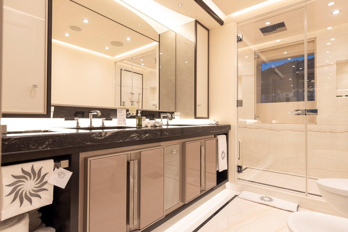 a bathroom with a large mirror aboard LUNA Yacht for Sale