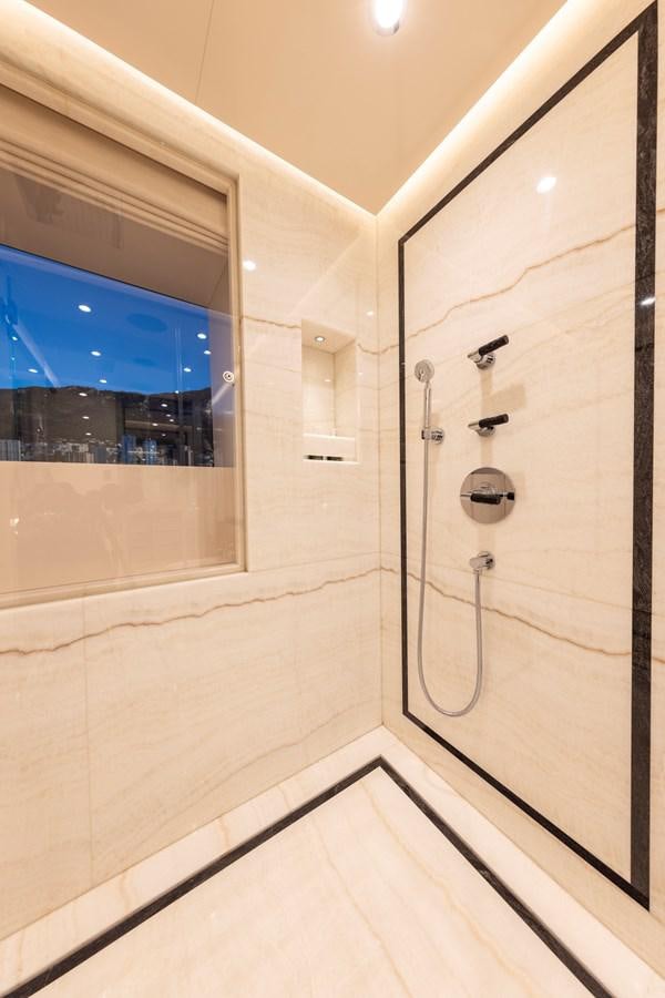 a shower unit in a bathroom aboard LUNA Yacht for Sale