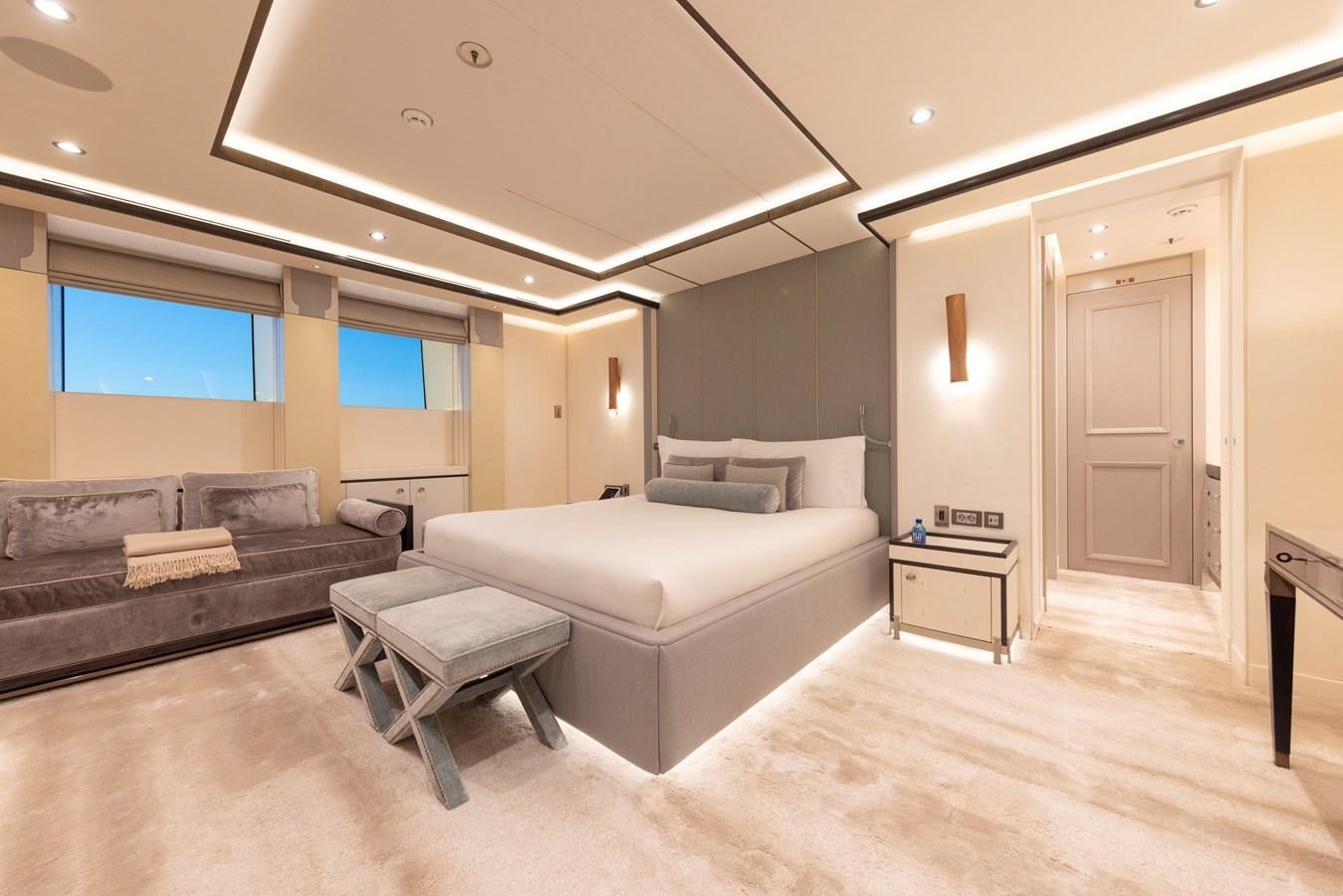 a living room with a couch and a table aboard LUNA Yacht for Sale