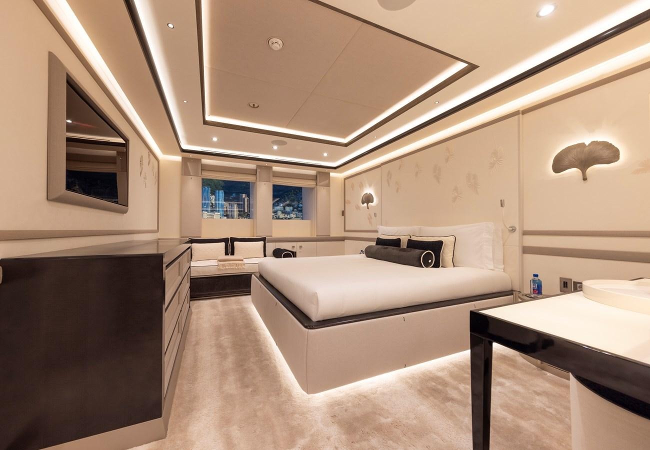a room with a couch and a table aboard LUNA Yacht for Sale