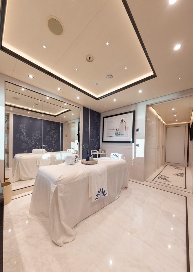 a large bathroom with a large mirror aboard LUNA Yacht for Sale