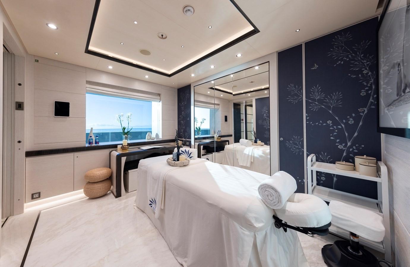 a large white bed in a room aboard LUNA Yacht for Sale