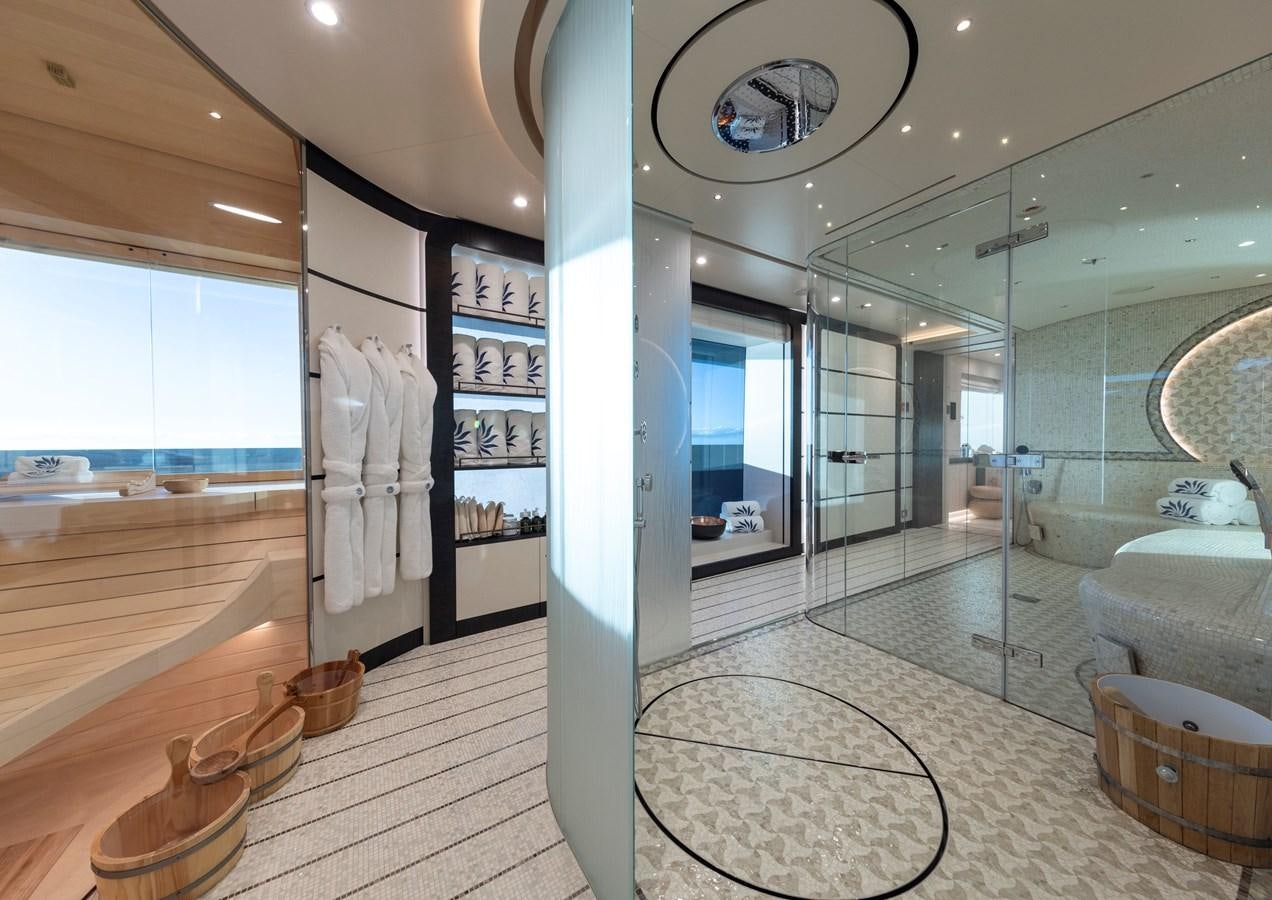 a large room with glass walls aboard LUNA Yacht for Sale