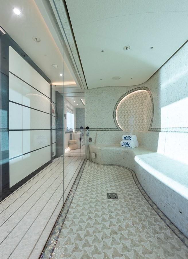 a bathroom with a tub and a sink aboard LUNA Yacht for Sale