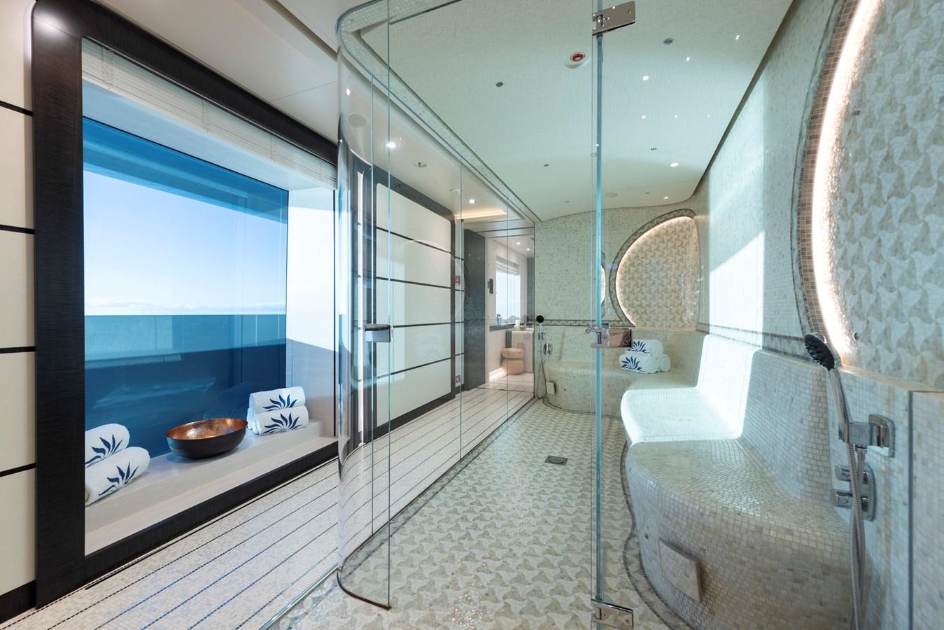 a bathroom with a glass shower aboard LUNA Yacht for Sale