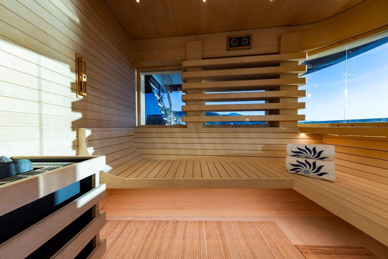 a room with a wood floor and a window with blinds aboard LUNA Yacht for Sale