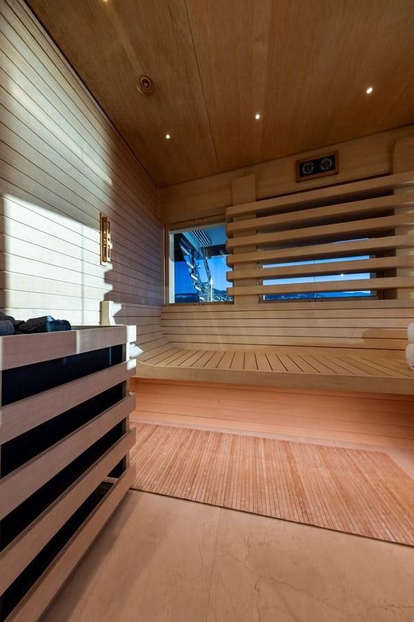 a room with a wood floor and a window with blinds aboard LUNA Yacht for Sale