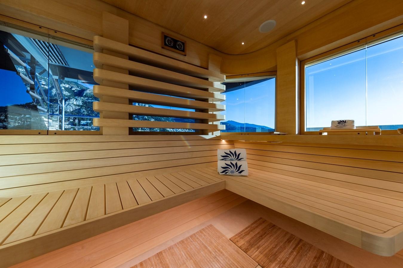 a room with a wood floor and a window with a sign on it aboard LUNA Yacht for Sale