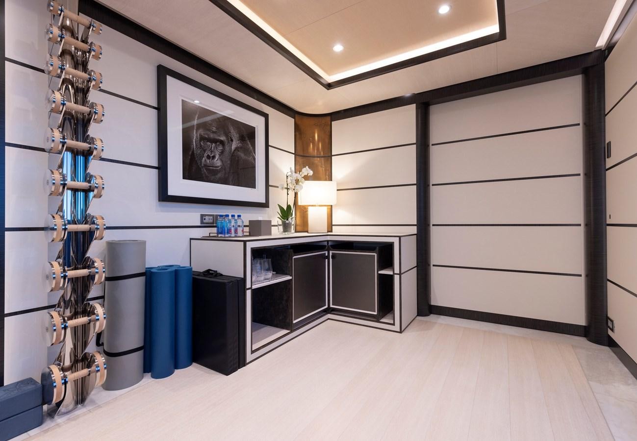 a room with a large shelf of computer equipment and a tv aboard LUNA Yacht for Sale