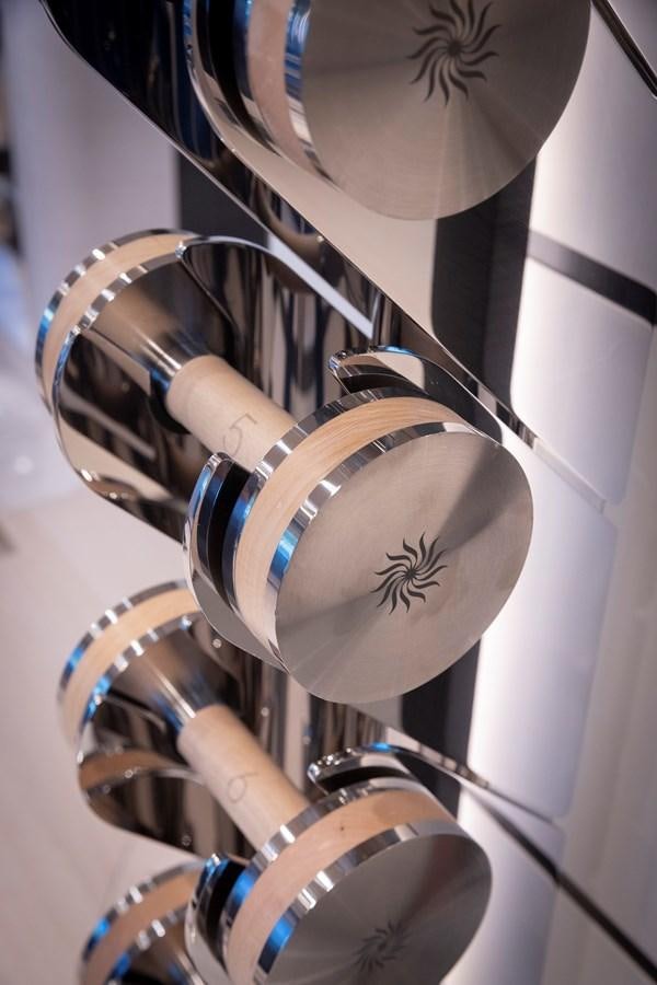 a group of white and gold microphones aboard LUNA Yacht for Sale