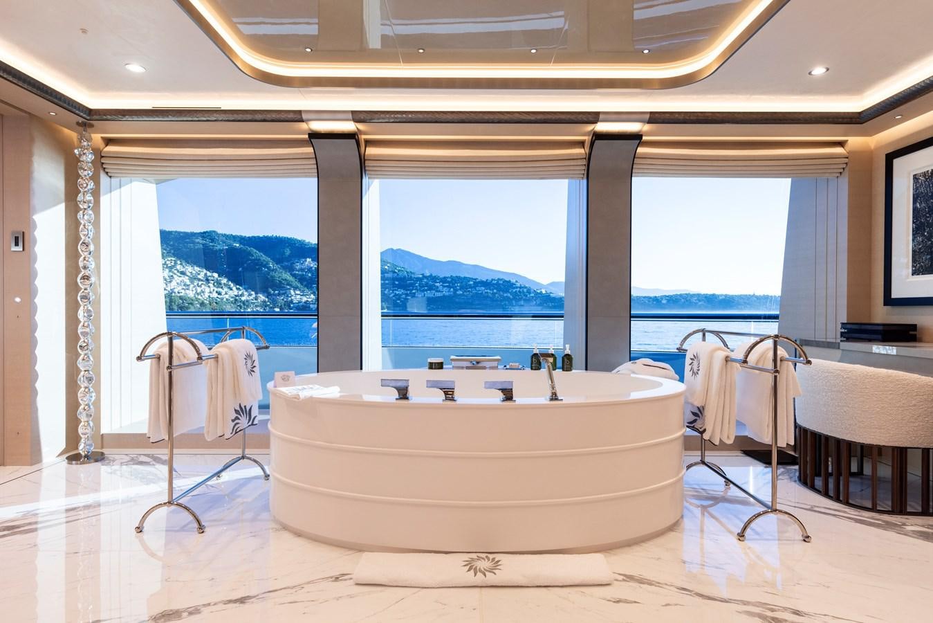 a large bathtub in a room aboard LUNA Yacht for Sale