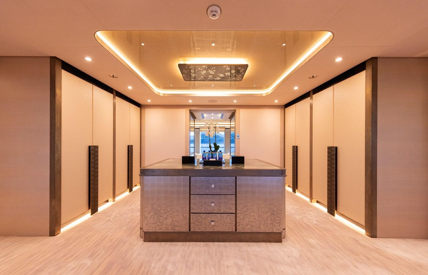 a room with a desk and a window aboard LUNA Yacht for Sale